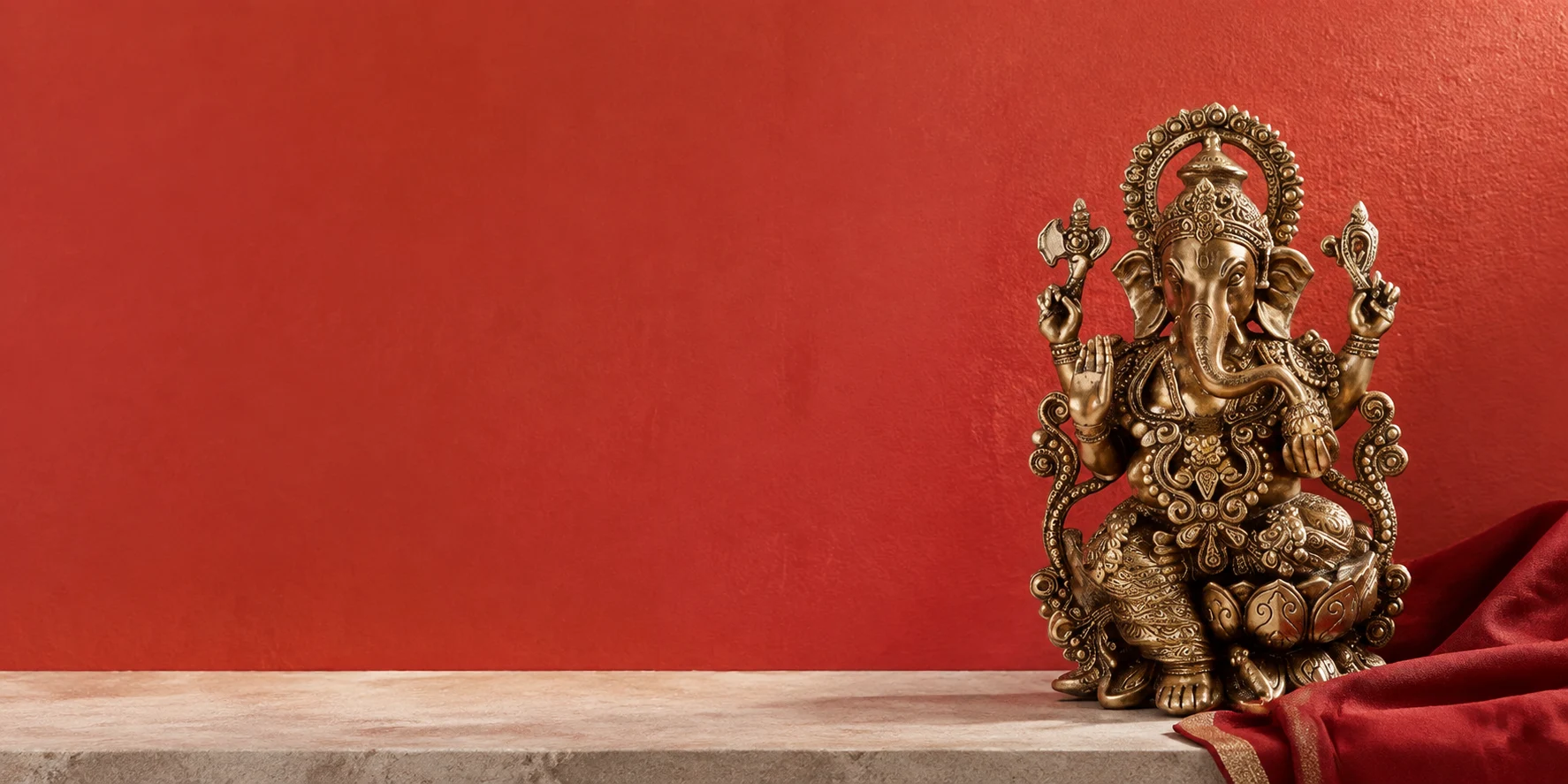 Kartique Mangalkari Ganesha in a styled red studio setting